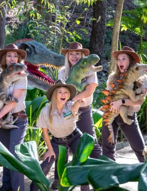 Keepers-dinosaur-puppets-posing-dinosaur-statue.jpg